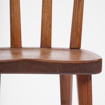 Axel Einar Hjorth, a set of four stained pine "Utö" chairs, Nordiska Kompaniet, Sweden, 1930s.