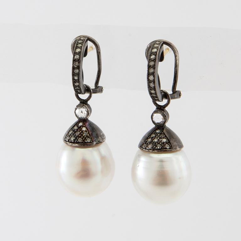 Earrings, a pair of oxidised silver with diamonds and cultured drop-shaped pearls.