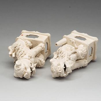 A pair of blanc de chine/bisquit porcelain joss stick holders, Transition, 17th Century.