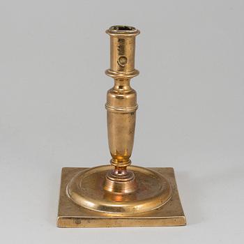 A 17th century bronze candlestick.