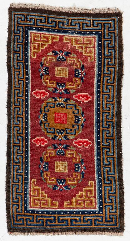 An antique Tibet 'Khaden' rug, c 135 x 70 cm.