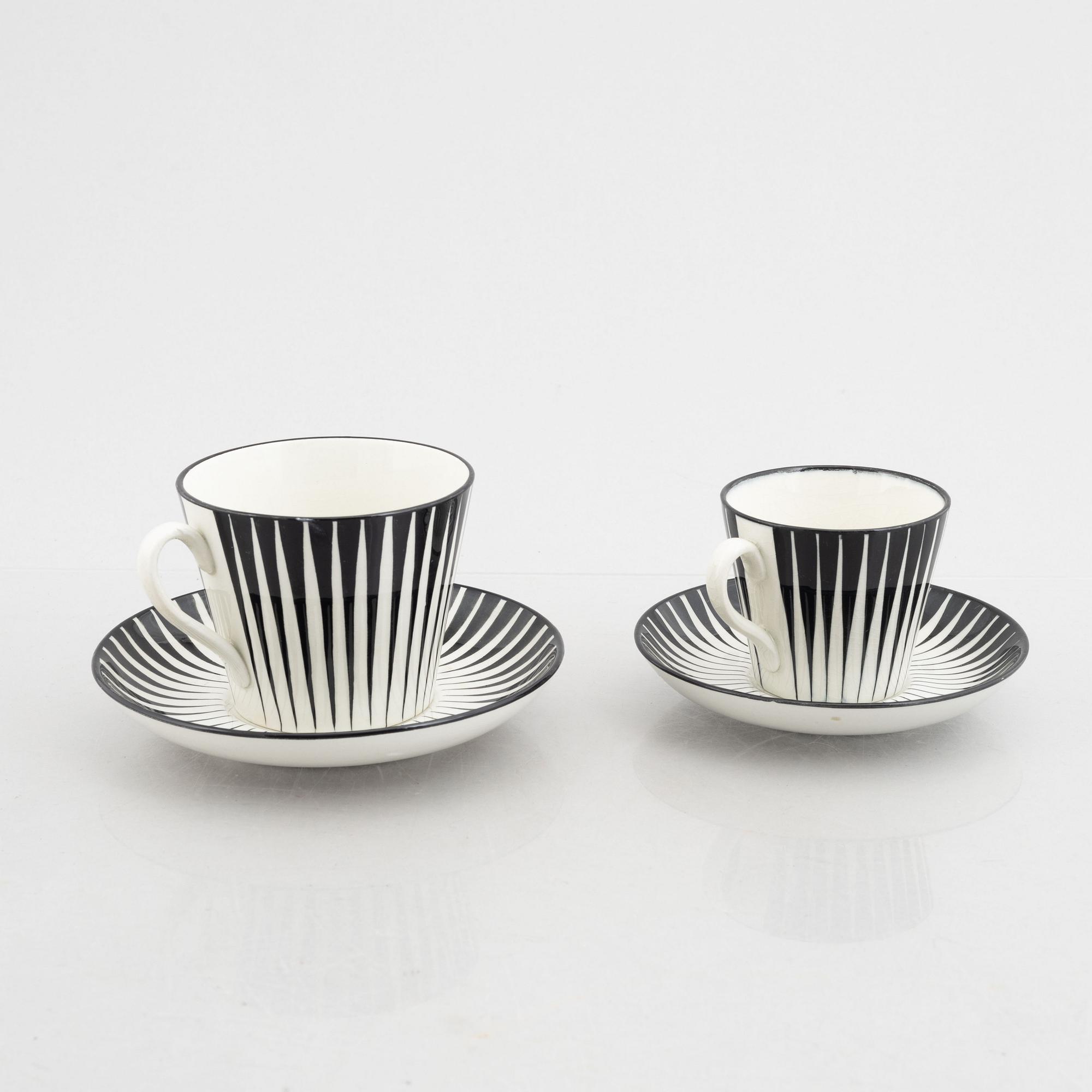 Eugen Trost, three creamware coffee cups with saucers and four tea cups with saucers, "Zebra", Upsala-Ekeby, Sweden.