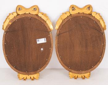 A pair of Gustavian style mirror sconces.