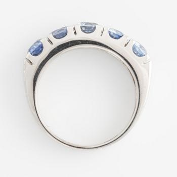 Ring with round faceted sapphires.