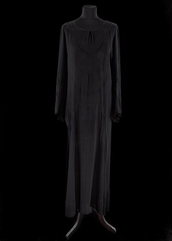 A 1910s/20s black evening dress.