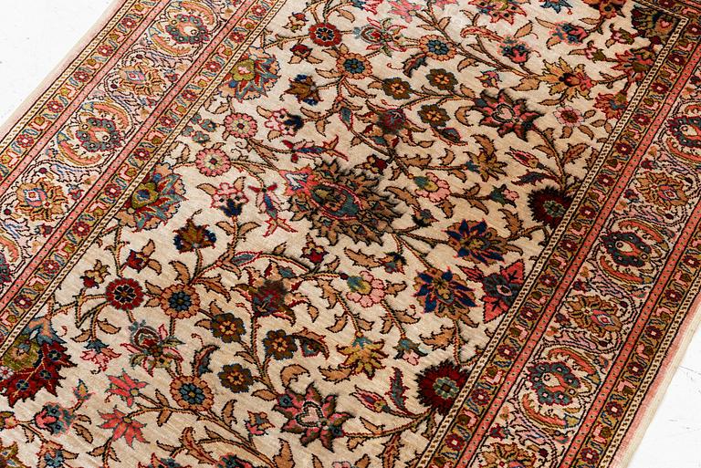 An Oriental silk rug, c. 122 x 76 cm.