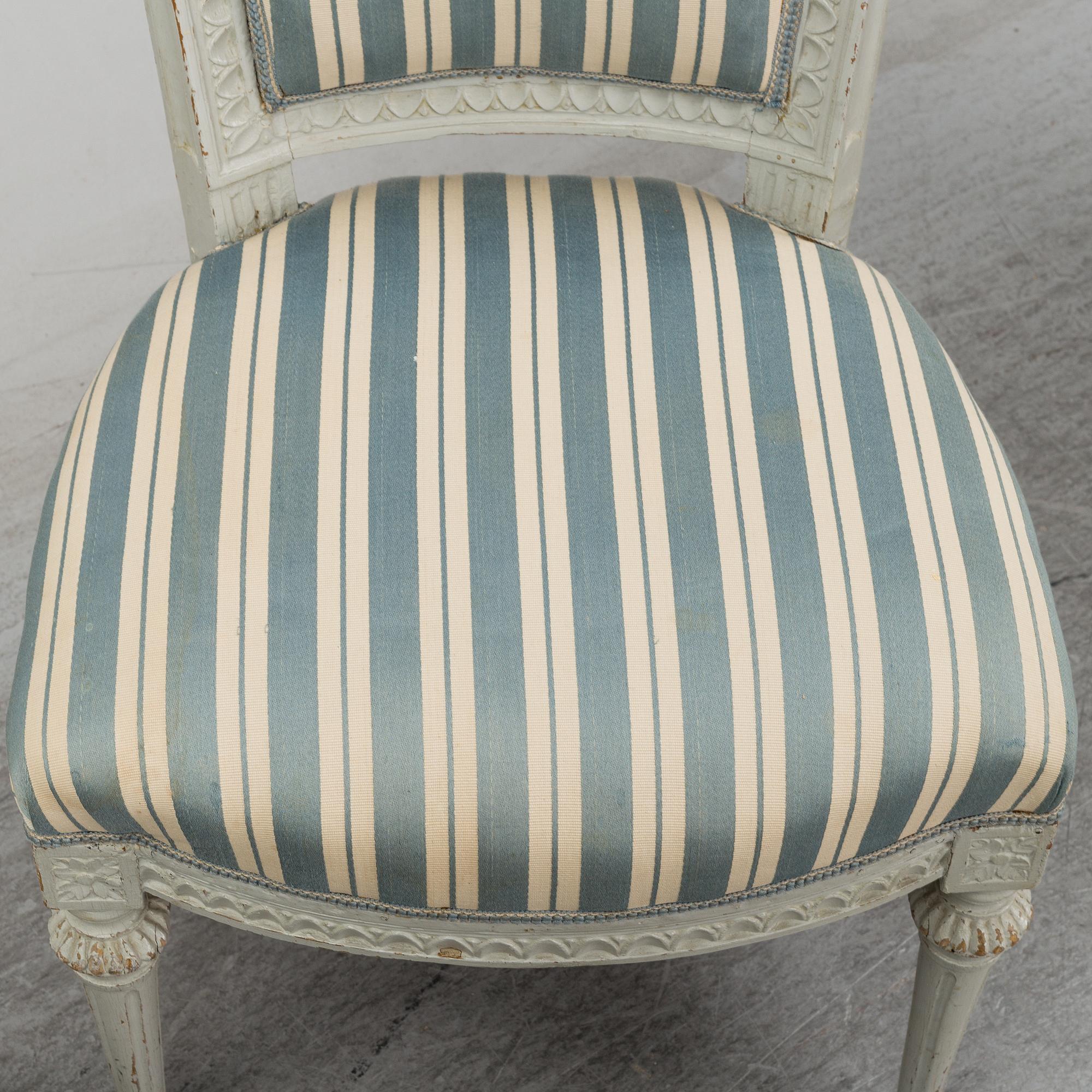 Six (3+2+1) late 18th century Gustavian chairs.