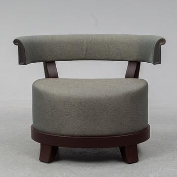 A contemporary 'Chelsea' armchair by Romeo Sozzi for Promemoria Furniture.