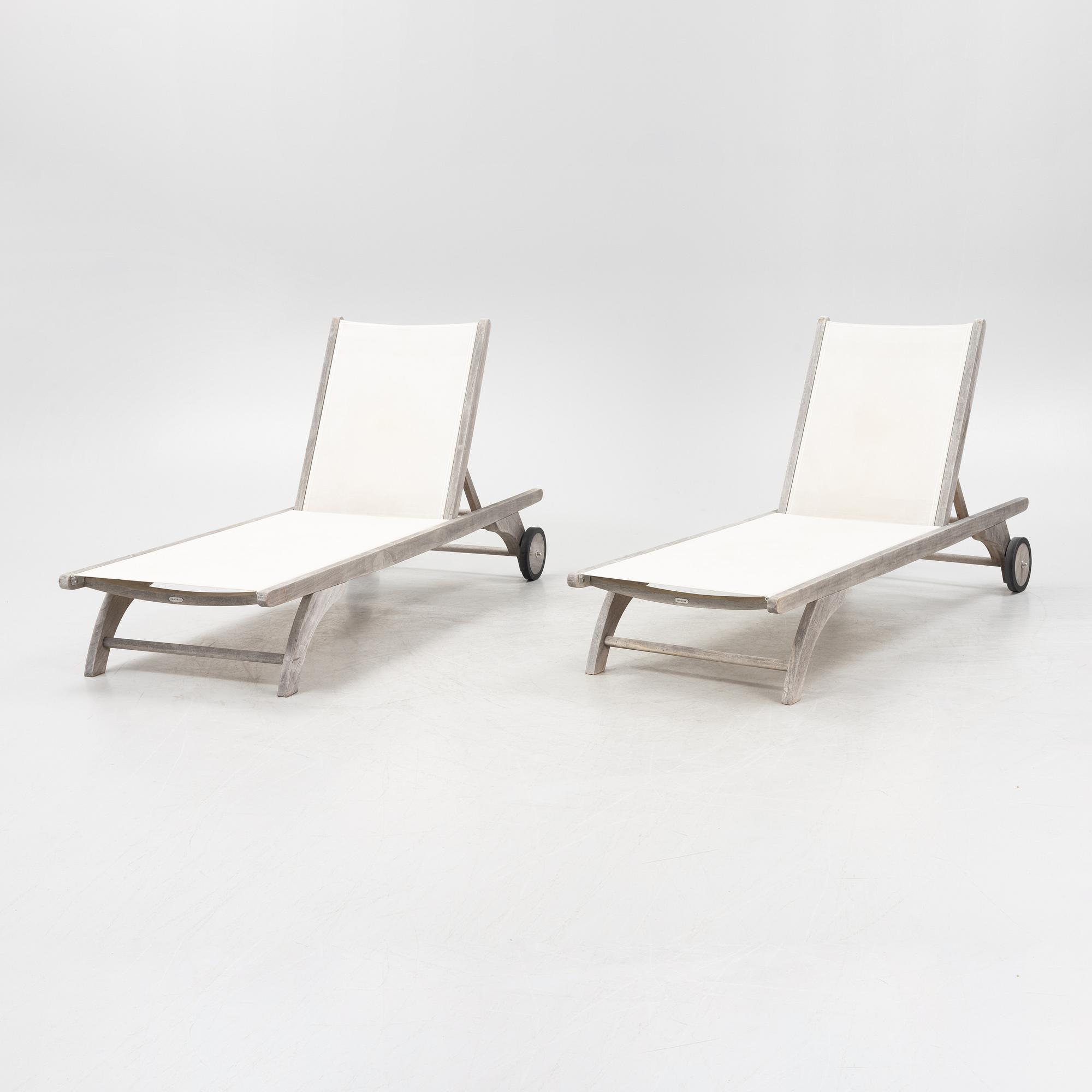 A pair of 'Columbus Sunbed' teak deck chairs, Skagerak, Denmark.