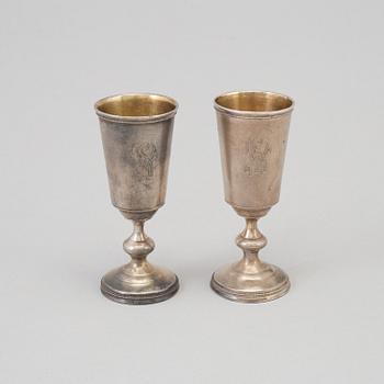 A pair of Russian parcel-gilt vodka cups, maker's mark cyrillic IB, St Petersburg, late 19th century.