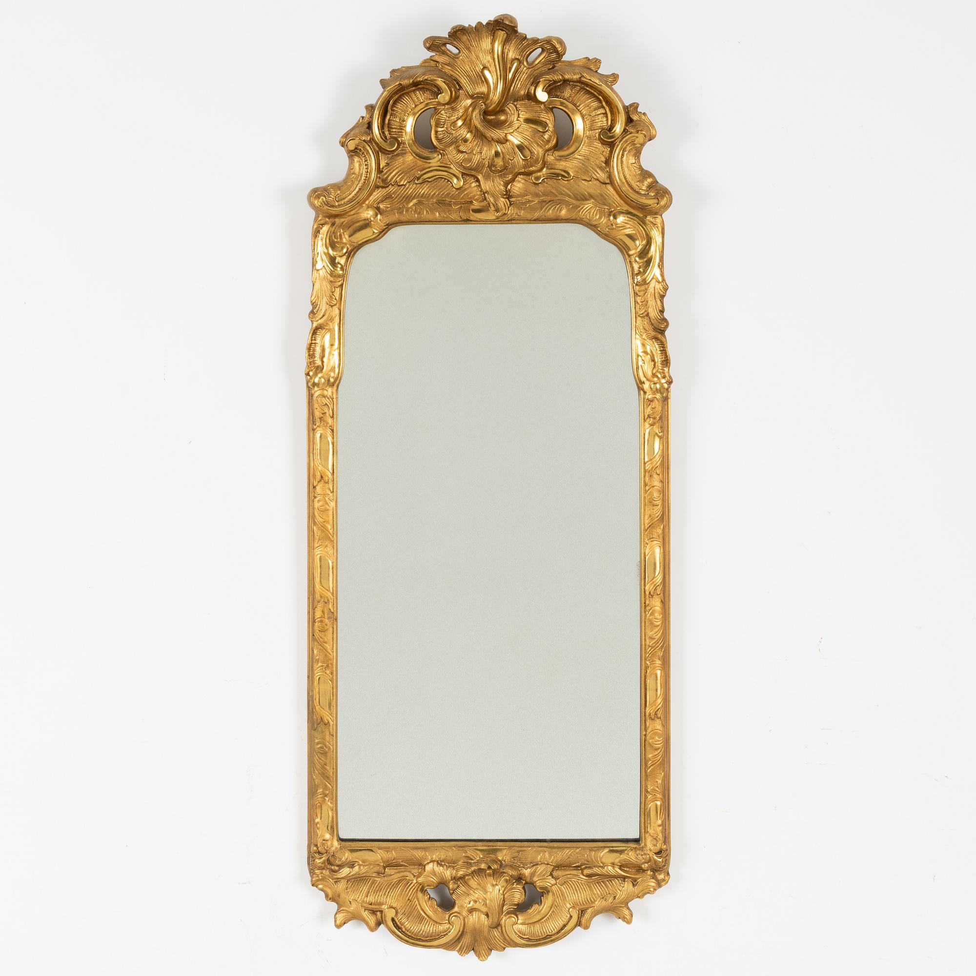 A Rococo style mirror, first half of the 20th Century.