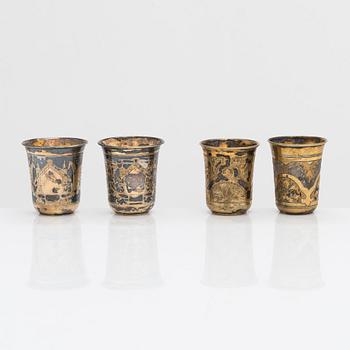 Four parcel-gilt silver beakers, Moscow 1870, 1876 and 1890.
