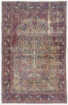 A semi-antique Kerman carpet, c. 325 x 203 cm.