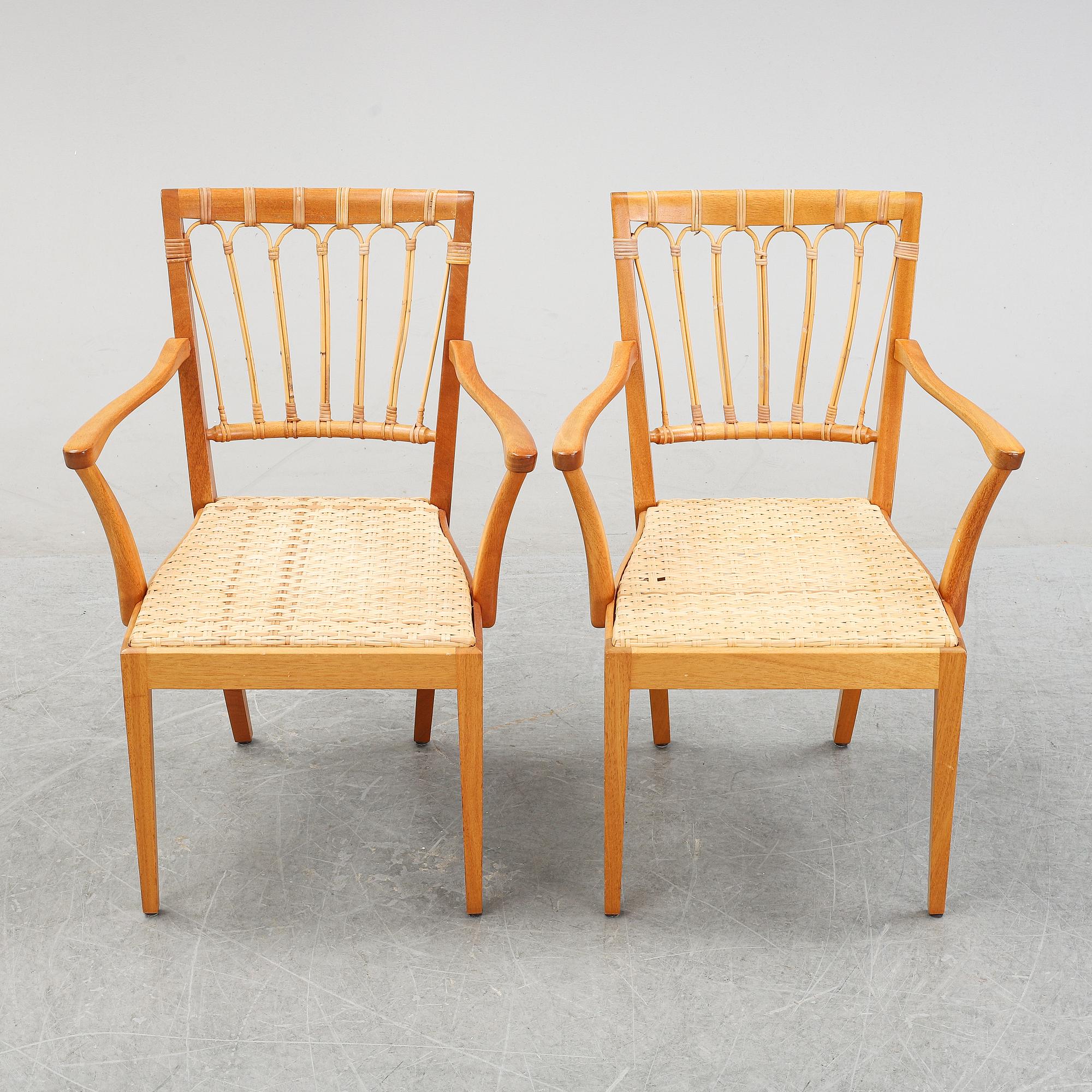 A pair of mahogany armchairs, model 1165, designed by Josef Frank in 1946 for Firma Svenskt Tenn.