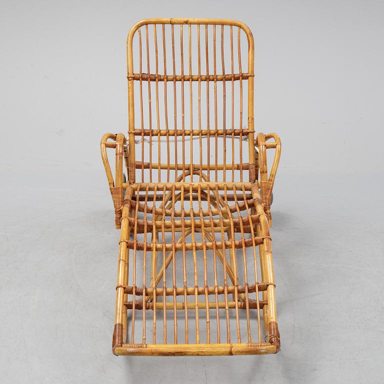 A rattan lounge chair.