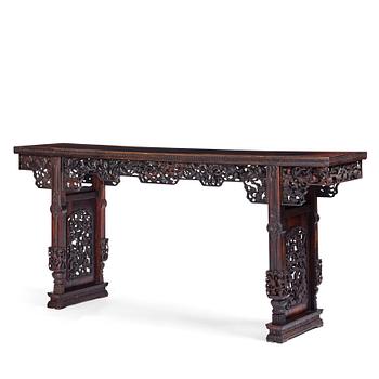 1195. A massive zitan recessed-leg long table 'Jiaotousun Qiotouan', Qing dynasty, 19th century.