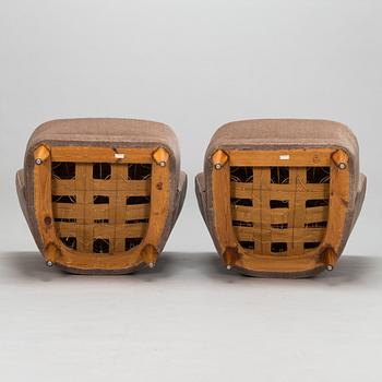 A mid-20th-century pair of armchairs.
