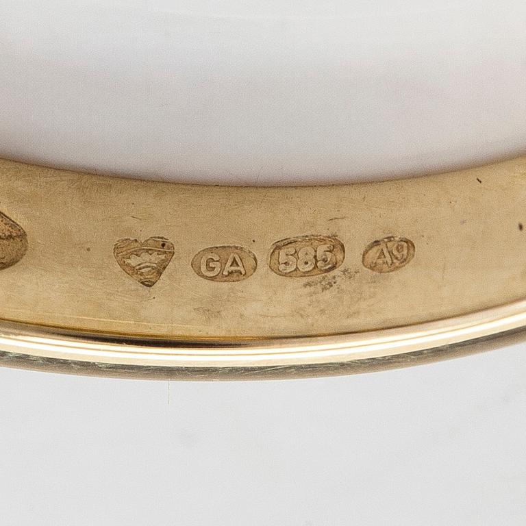 A half-eternity 14K gold ring with sapphires.