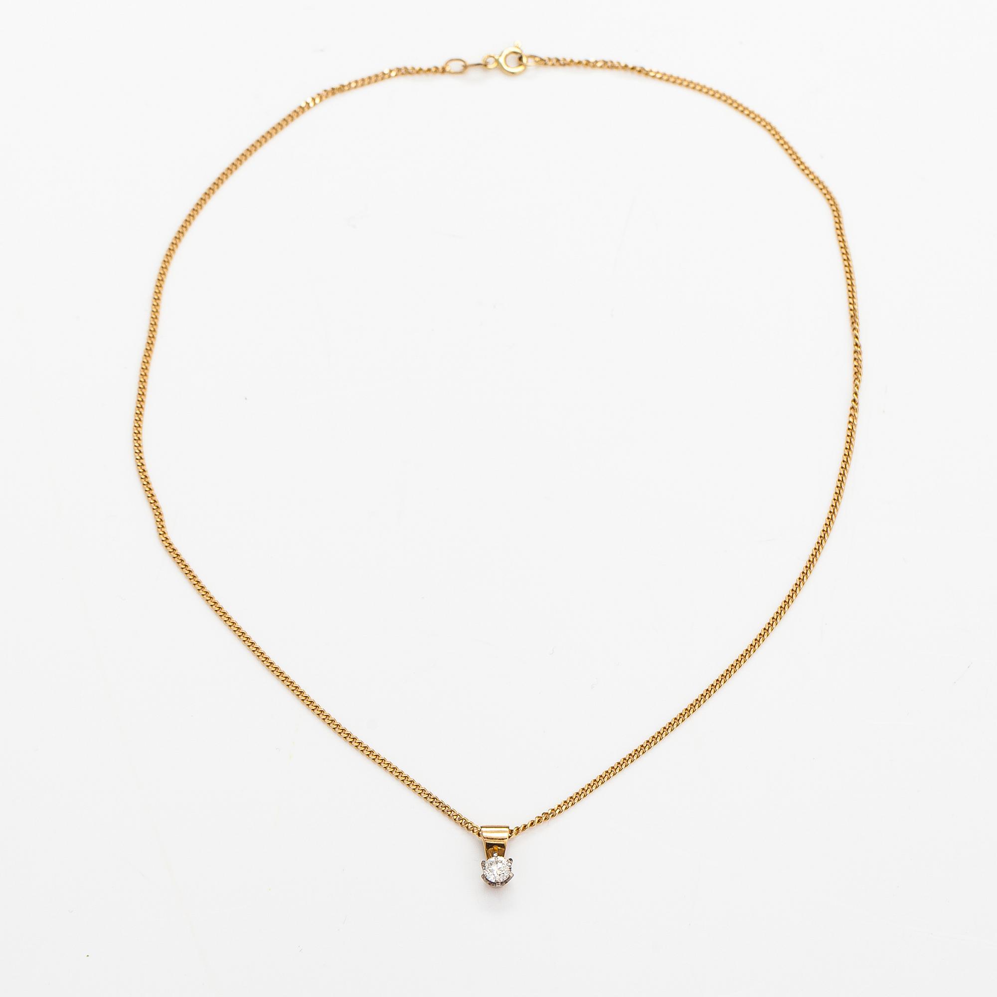 A 14K gold neckalce with a ca. 0.45 ct diamond according to engraving.