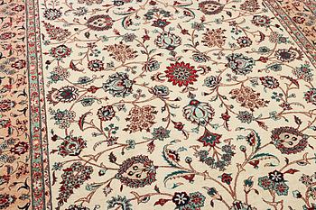 An oriental silk carpet, a. 280 x 185 cm.