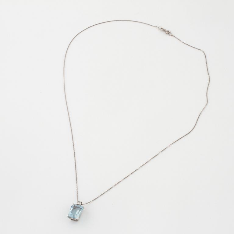 A aquamarine and briliant cut diamond pendant.