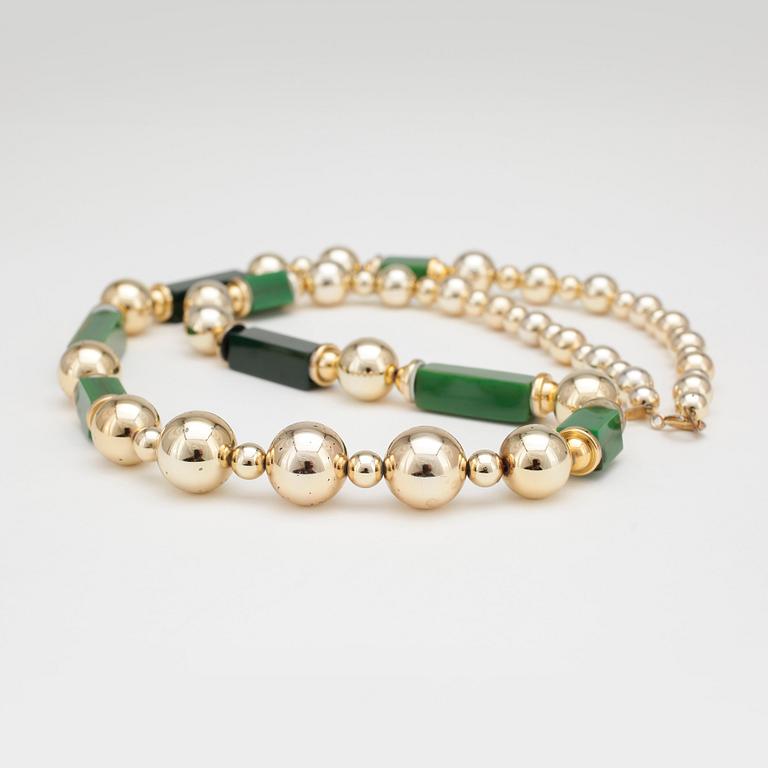 CHRISTIAN DIOR, a gold and green colored necklace from 1970s.