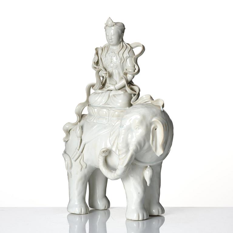 A large blanc-de-chine figure of Guanyin riding an elephant, late Qing dynasty/early 20th Century.