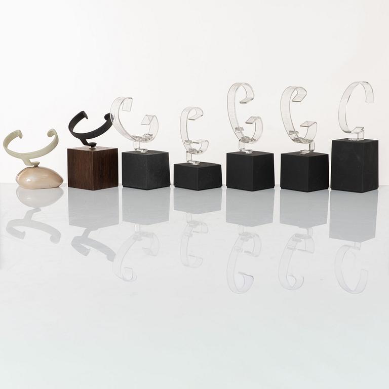 Clock stands, 7 pcs, Breitling, TAG Heuer and Girard-Perregaux.