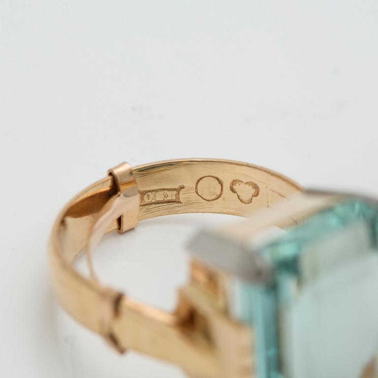 A step-cut aquamarine ring.