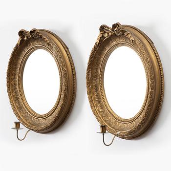 A pair of gilt-gesso one-branch girandole mirrors, later part 19th century.