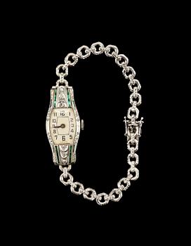 DAMARMBANDSUR, 18k vitguld med smådiamanter och smaragder, Malmö, 1953.