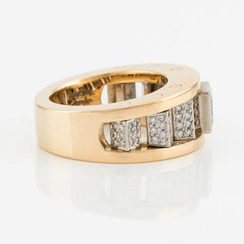 An 18K gold Gaudy ring with a princess-cut diamond.