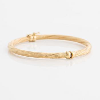 Bangle, 18K gold, twisted decoration, Uno A Erre, Italy.