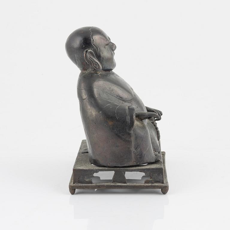 A bronze figure of Buddai, Qing dynasty (1664-1912).
