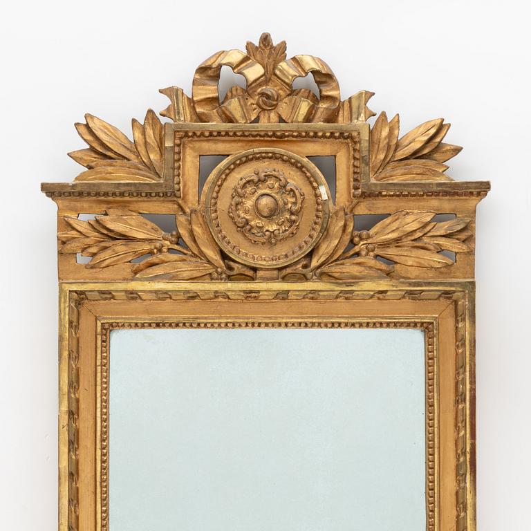 A Gustavian giltwood mirror by L. Lundén (master in Stockholm 1773-1819).