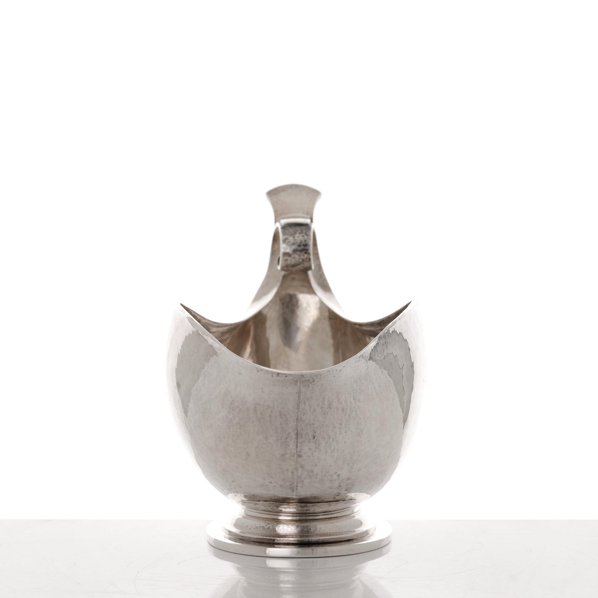 Georg Jensen, a sterling silver sauceboat and ladle, Copenhagen 1925-1945, design nr 98 and 141.