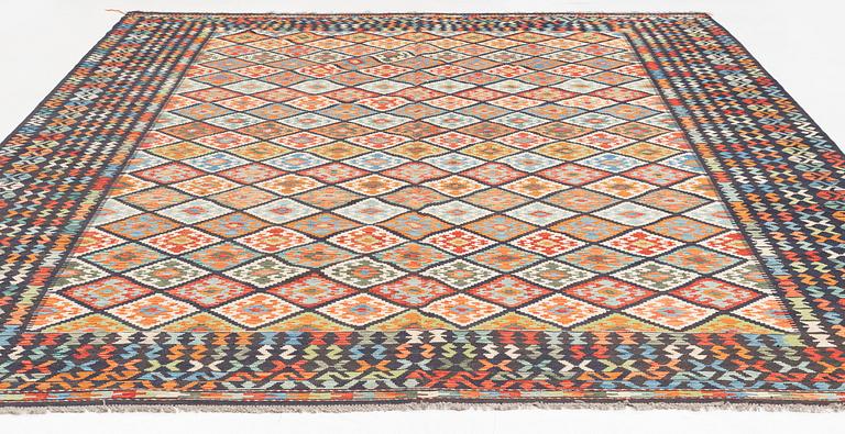 A kilim carpet, circa 396 x 310 cm.