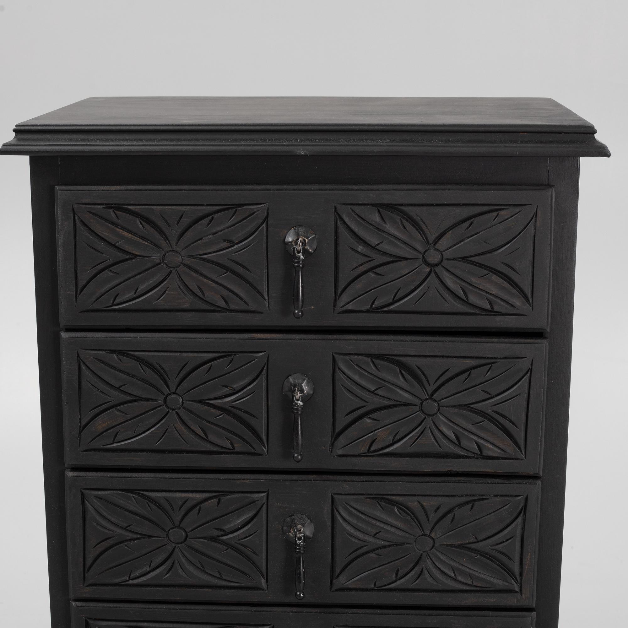 A carved and painted chest of drawers, late 20th Century.