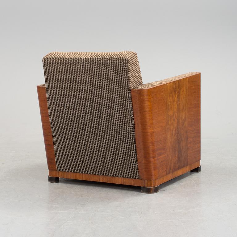 An Art Deco armchair veneered with walnut from the 1930's.