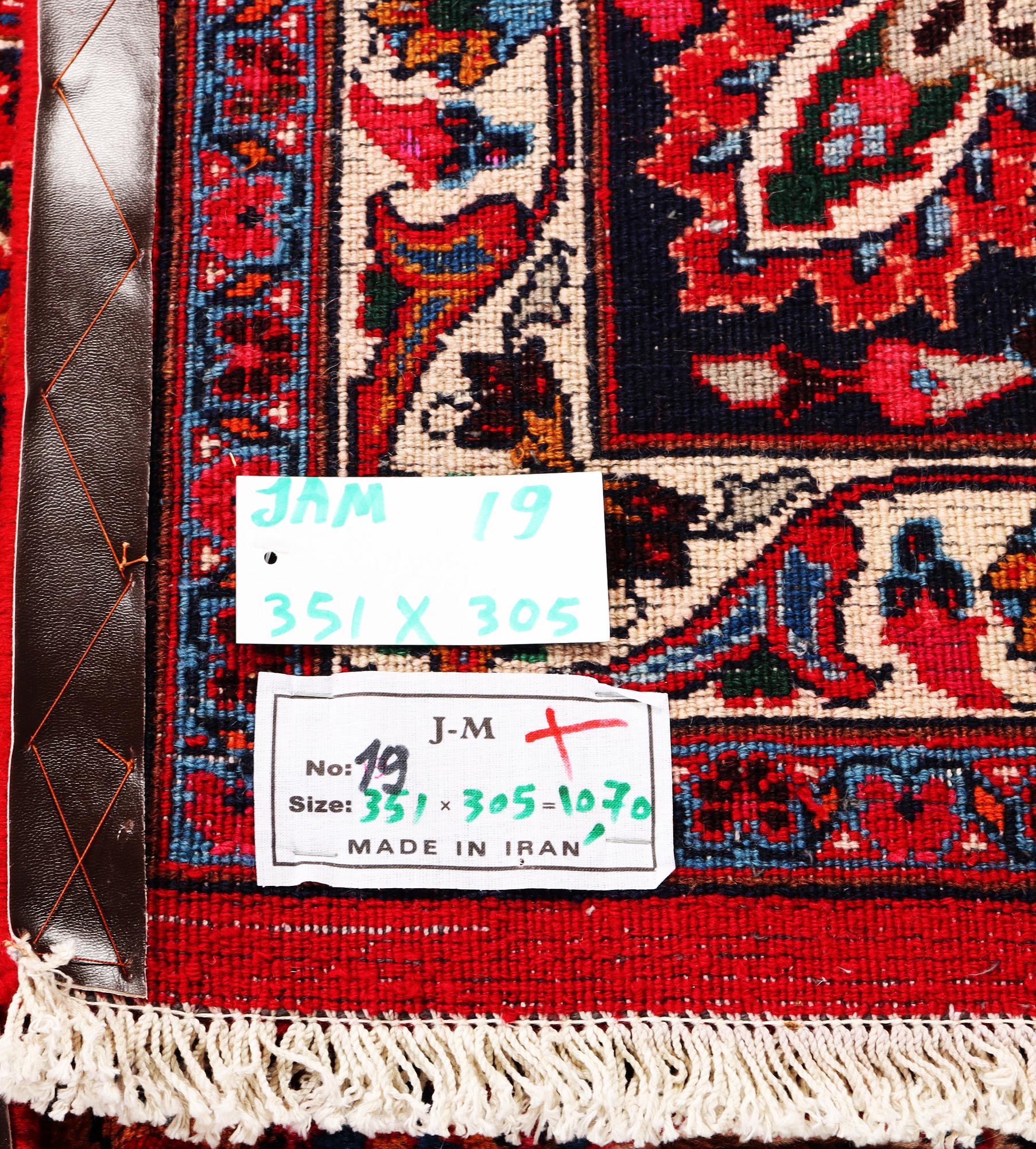 A Najafabad carpet, c. 351 X 305 cm.