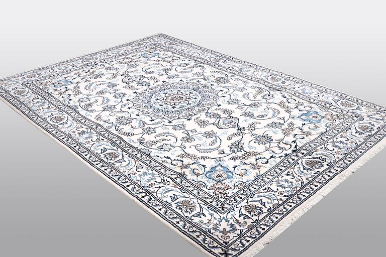 A carpet, Nain, 285 x 196 cm.