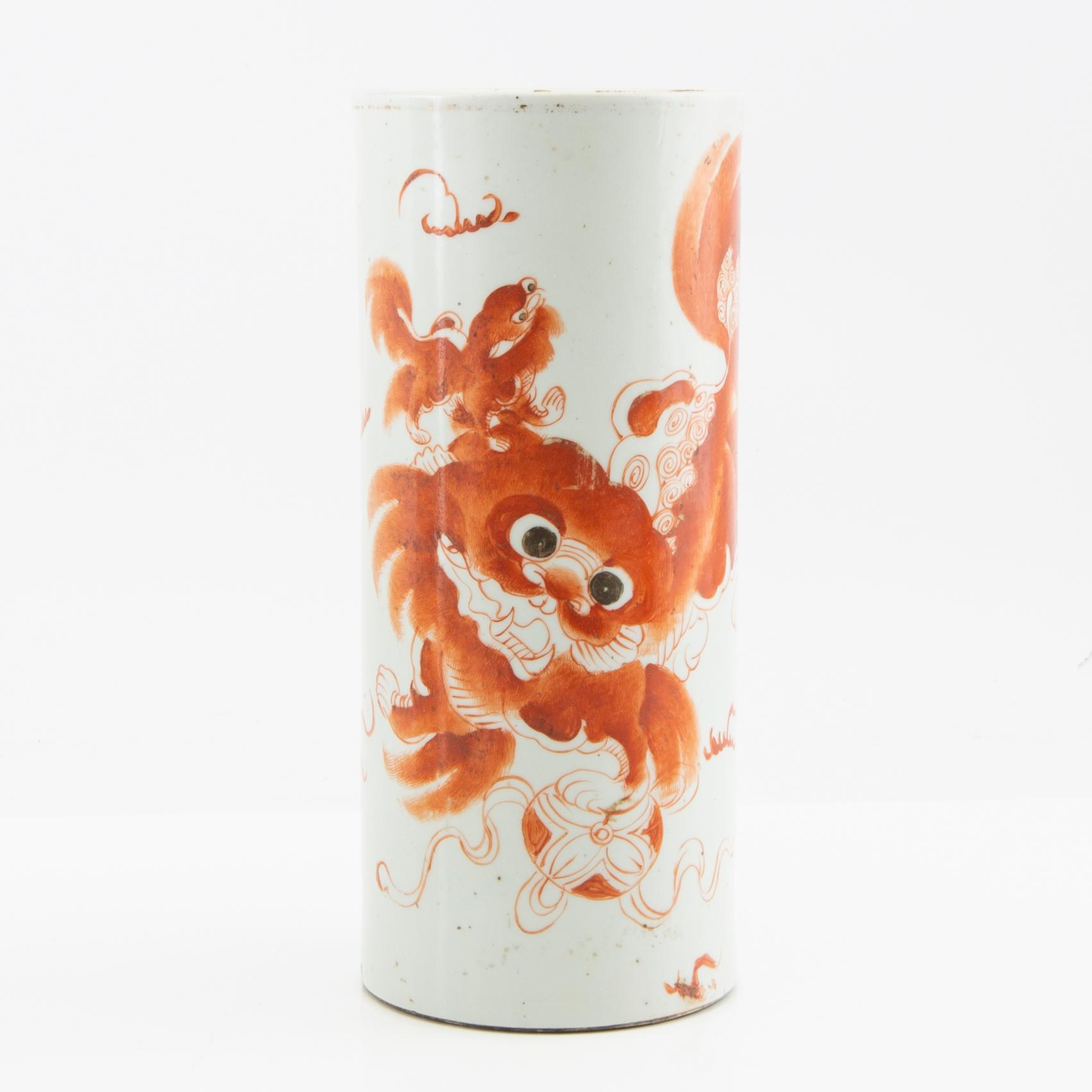 A brush vase decorated in red with buddhist lions and calligraphy, early 20th century.