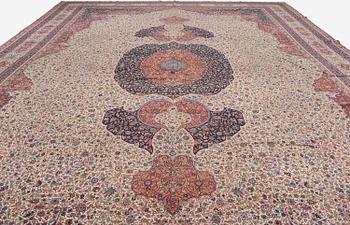 A semi-antique Hereke carpet, Western Turkey, c. 685 x 489 cm.