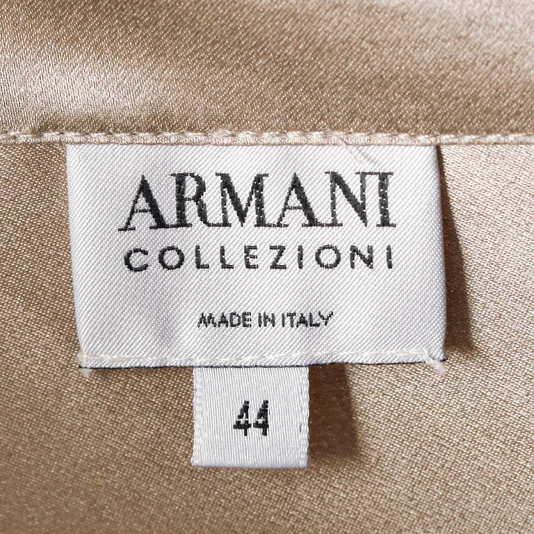 ARMANI, a silver coloured silk blouse.