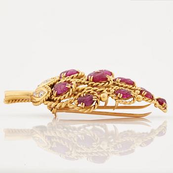 A 1950/60's brooch by Cartier, in the shape of a strawberry, set with carved rubies and brilliant cut diamonds.