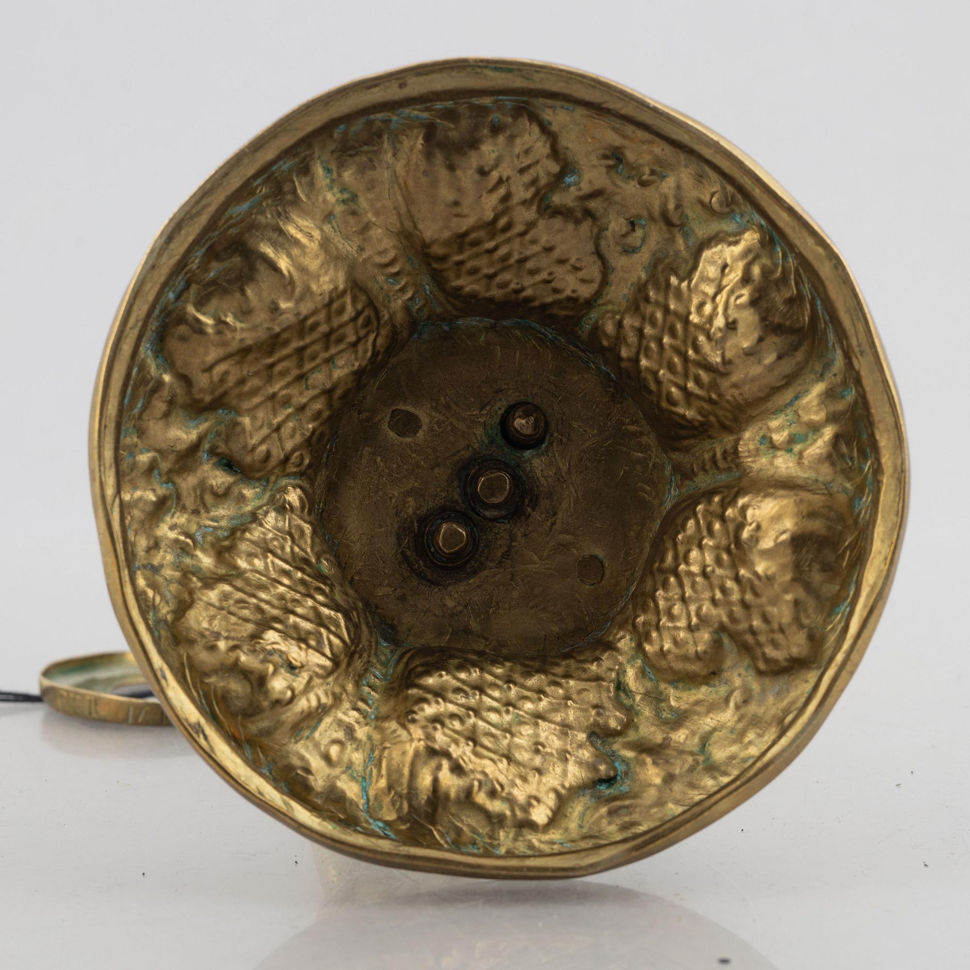 A rococo-style brass candlestick, 18th century and later.