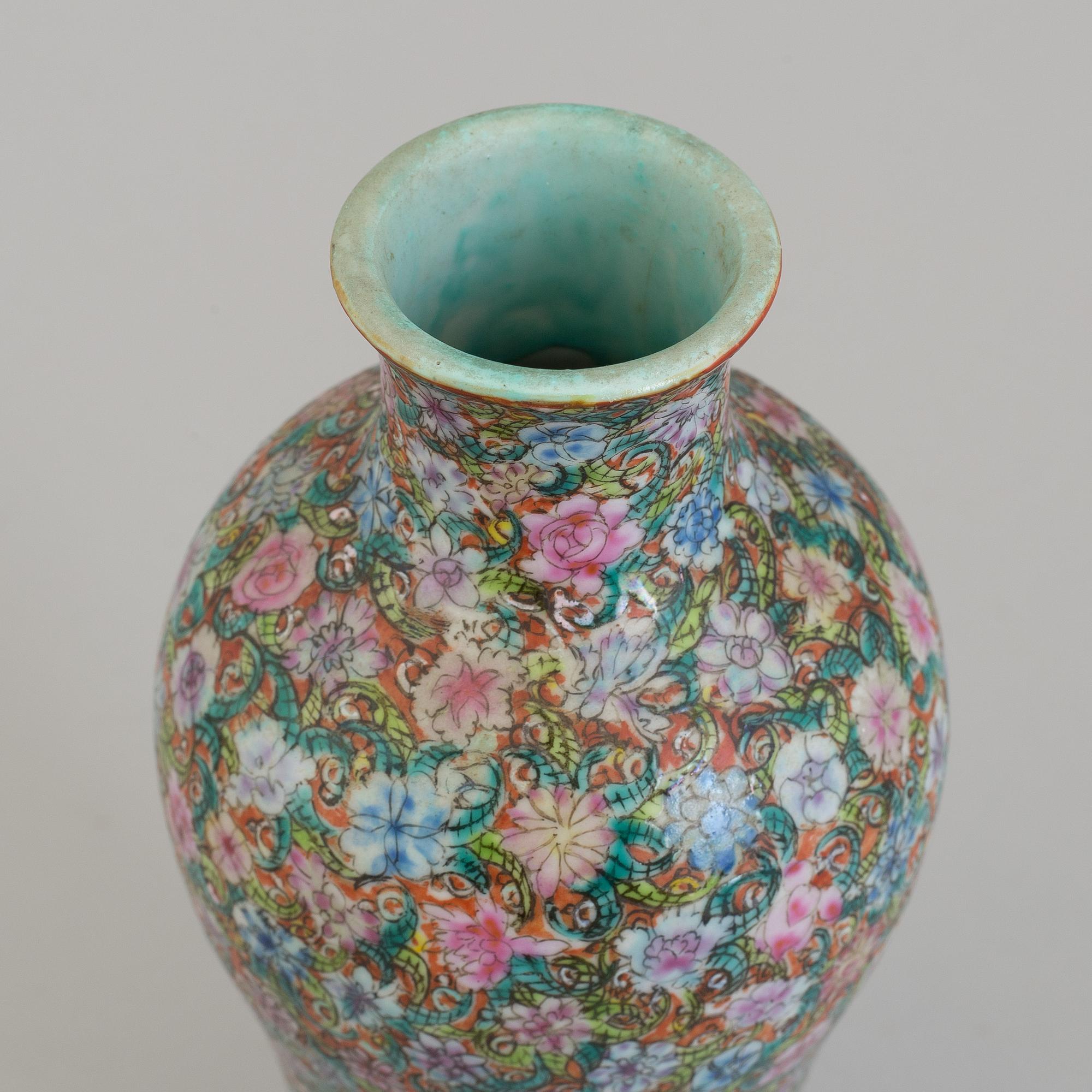A Chinese 20th century famille rose 'mille fiore' vase, with Qianlong seal mark.
