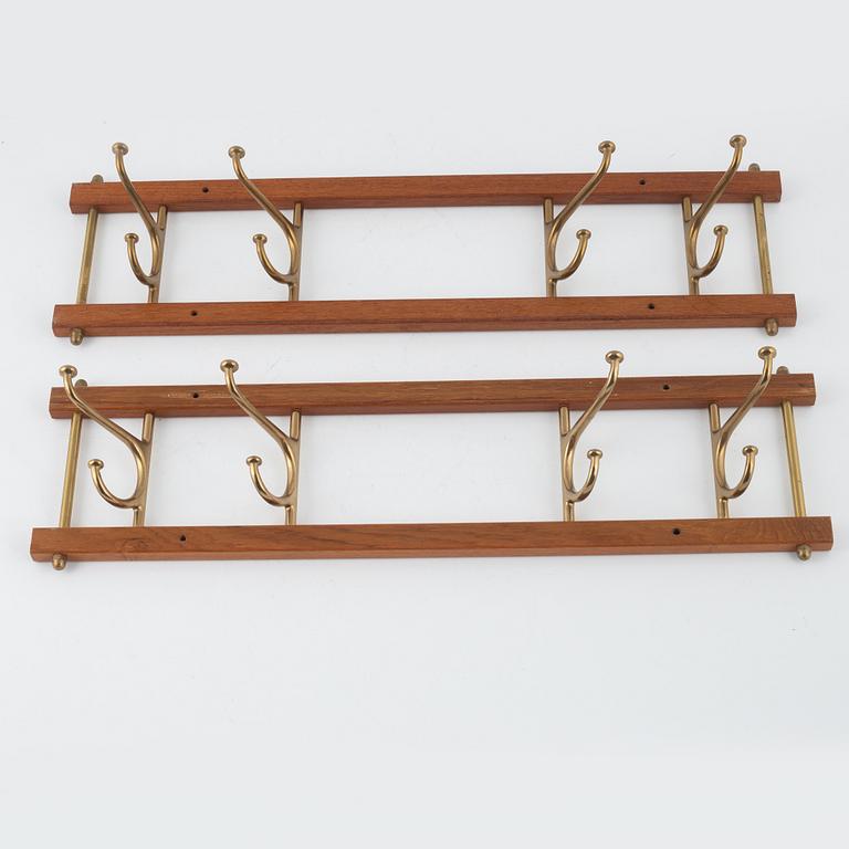 A pair of 'Dekorativ' coat hangers, Skoglunds metallgjuteri, Anderstorp, mid 20th Century.