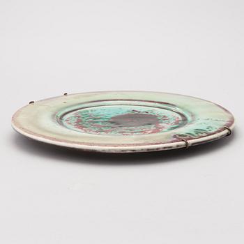 A mid-20th century glazed ceramic dish, signed TM.