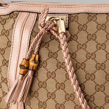 Gucci, a monogram canvas bag.